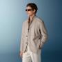 This sand blazer is cut to a relaxed fit for a comfortable, slightly looser silhouette with natural shoulders. It features wide notch lapels, patch pockets, and a single-breasted closure.