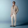 This sand blazer is cut to a relaxed fit for a comfortable, slightly looser silhouette with natural shoulders. It features wide notch lapels, patch pockets, and a single-breasted closure.